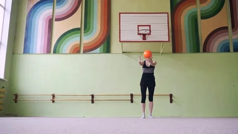 A girl is training with a gymnastic ball. Stock Footage