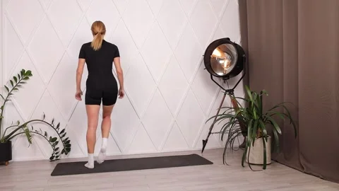 Girl training. Side lunges on one leg from the back Stock Footage 280159876