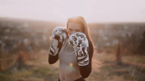 The girl is training in the top of the mountains Stock Footage