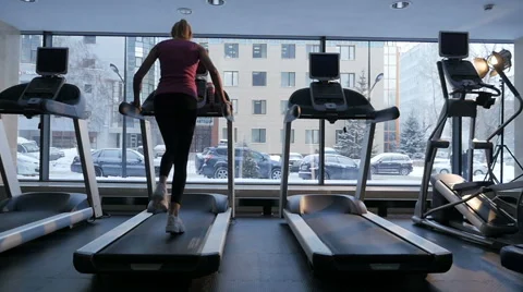 Girl on the treadmill Stock Footage 59936983