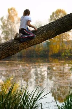 The girl on a tree Stock Photos