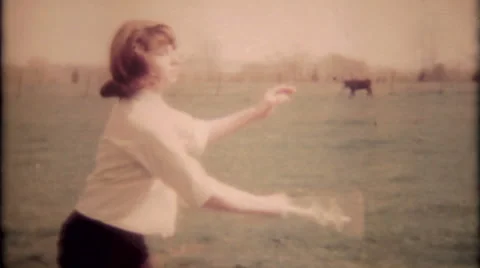 Girl tries new tricks while baton twirling 1950s vintage film home movie 1378 Stock Footage