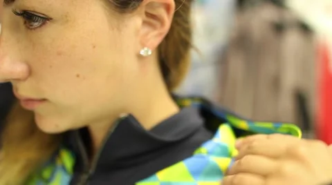 Girl trying on a cap Video stock 59852668