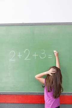 Girl trying do an excercise of math Stock-Fotos