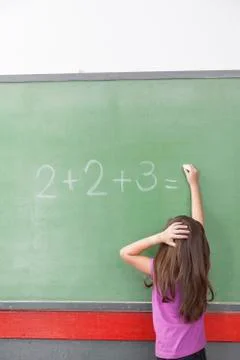 Girl trying do an excercise of math Stock-Fotos
