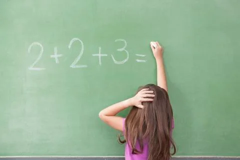 Girl trying do an excercise of math Stock Photos