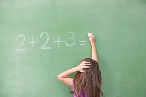 Girl trying do an excercise of math Stock Photos