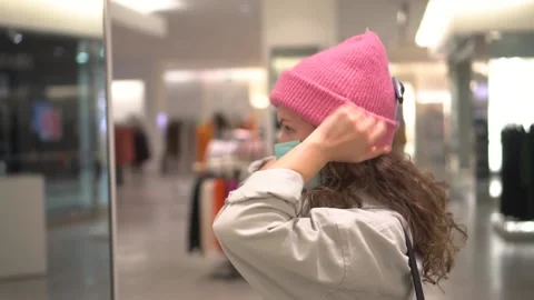 Girl Trying on a Hat in the Store. Stock Footage 170609796
