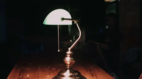 Girl turned off the table lamp Stock Footage 76583784