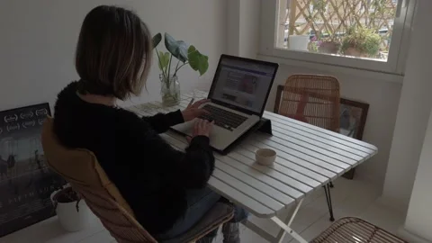 Girl types computer keyboard. Smart work at home. Video stock 153442640