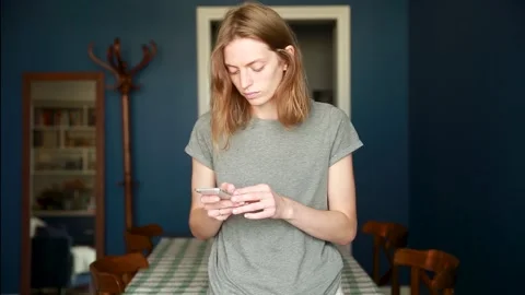 The girl types a message on her phone Stock Footage 138981908