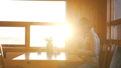 Girl types a message in the warm sunlight Stock Footage 89802185
