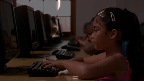 Girl typing on computer with maths symbols Stock Footage 104931339