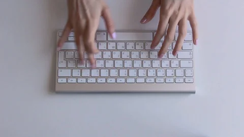Girl typing on computer on white background Stock Footage 87951173