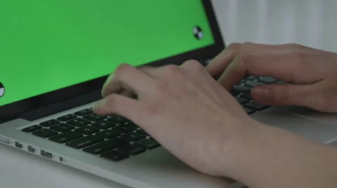 Girl typing with Green Screen macbook pro Stock Footage 59770040