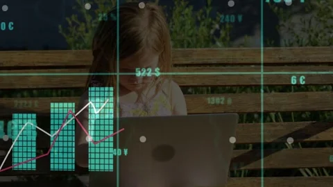 Girl typing on laptop while seated bench, generating live finance charts and Stock Footage 332545251