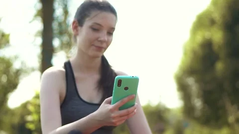 Girl typing a message on the phone Stock Footage 274316909