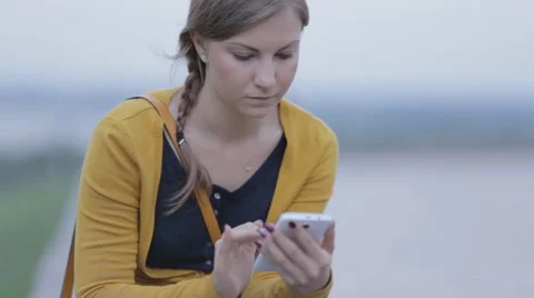 Girl is typing a message on a small tablet Stock Footage 53501486