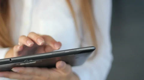 Girl typing on tablet computer Video stock 55250746