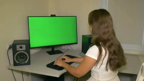 Girl is typing text on the keyboard. Chromakey on computer screen. Stock Footage 208011153