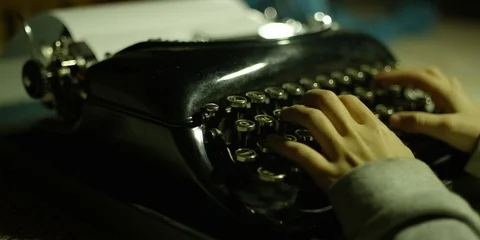 A girl typing on a typewriter Stock Footage 119098802