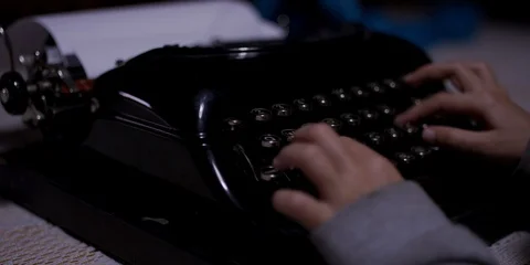 A girl typing on a typewriter Stock Footage 119098809