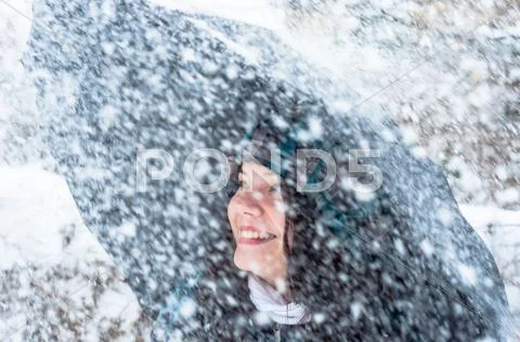 Girl With Umbrella In The Snow