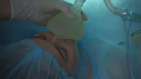 Girl under anesthesia on the operating table. The process of gynecological Stock Footage 83645486
