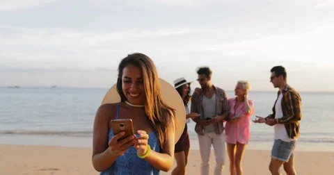 Girl Use Cell Smart Phone Welcome People Group To Take Selfie Photo On Beach Stock Footage