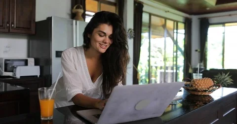 Girl Use Laptop Computer In Kitchen Chatting Online Young Woman Drink Juice Stock Footage