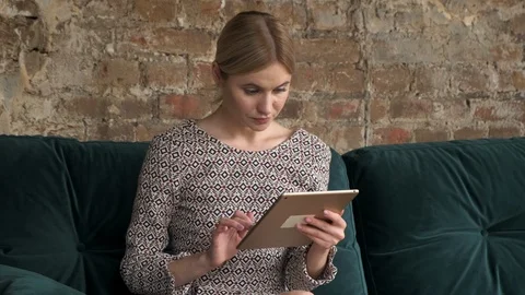 Girl Use Tablet Computer Laughing, Young Woman In home Chatting Online Studio Stock Footage 120007487