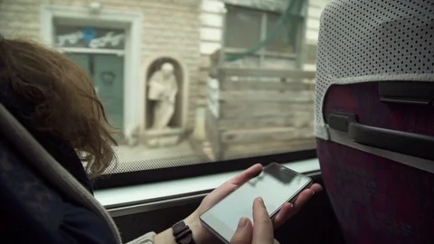 The girl uses the phone on the bus Stock Footage