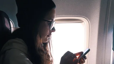 Girl uses smartphone while flying Stock Footage 111149763