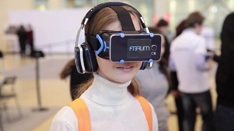 Girl uses virtual reality game development kit, virtual reality glasses 스톡 동영상 80897920