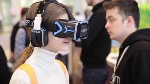 Girl uses virtual reality game development kit, virtual reality glasses Stock Footage 80897922