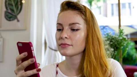 Girl using app on cellphone Stock Footage 88694313