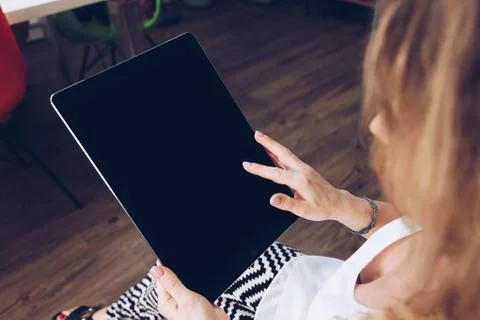 Girl using a big tablet Stock Photos