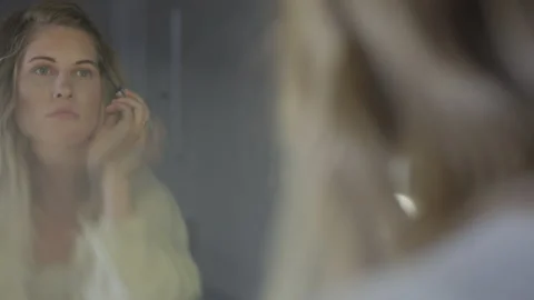 Girl Using Brush to Apply Makeup to Eye Brows Stock Footage 208721521