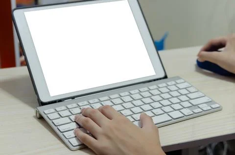 Girl using a computer keyboard. Studying online at home.Playing computer ga.. Stock Photos