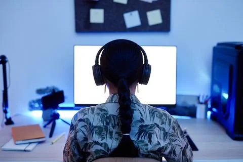 Girl using Computer at Night Back View Stock Photos