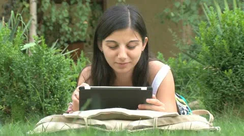 Girl using digital tablet Stock Footage 11366910