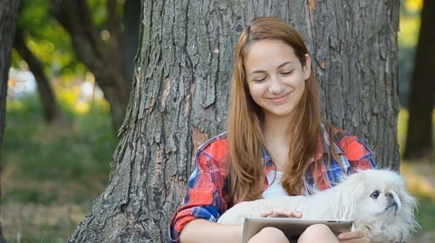 Girl using a digital tablet outdoors Stock Footage 56690409
