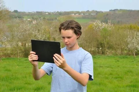 Girl using digital tablet Stock Photos