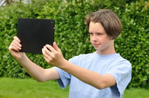Girl using digital tablet Stock Photos