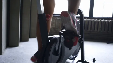 Girl using exercise equipment in modern gym Stock Footage 123073304