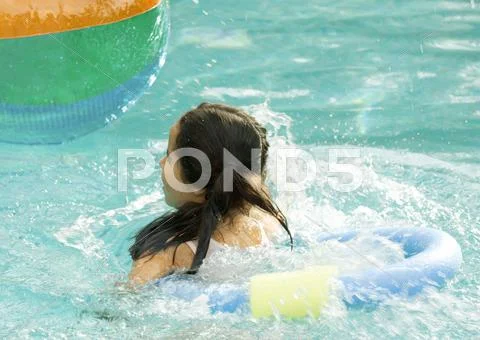 Girl Using Floating Ring In Pool