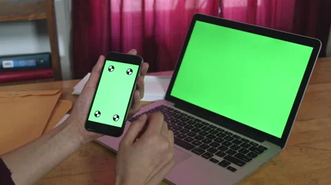 Girl Using a green screen iphone and macbook pro Stock Footage 59772991