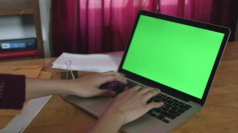 Girl Using a green screen macbook pro Stock Footage 59771480