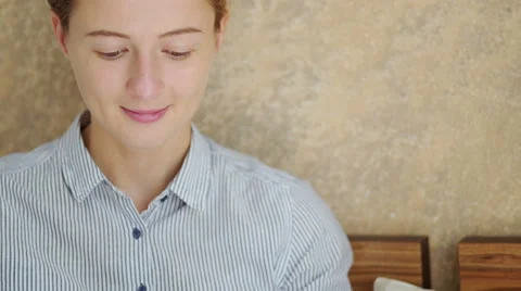 Girl using her smartphone while sitting down in bed. Close-up Stock Footage 66468949