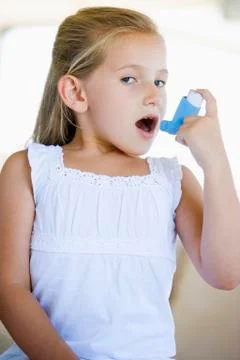 Girl Using An Inhaler Stock Photos
